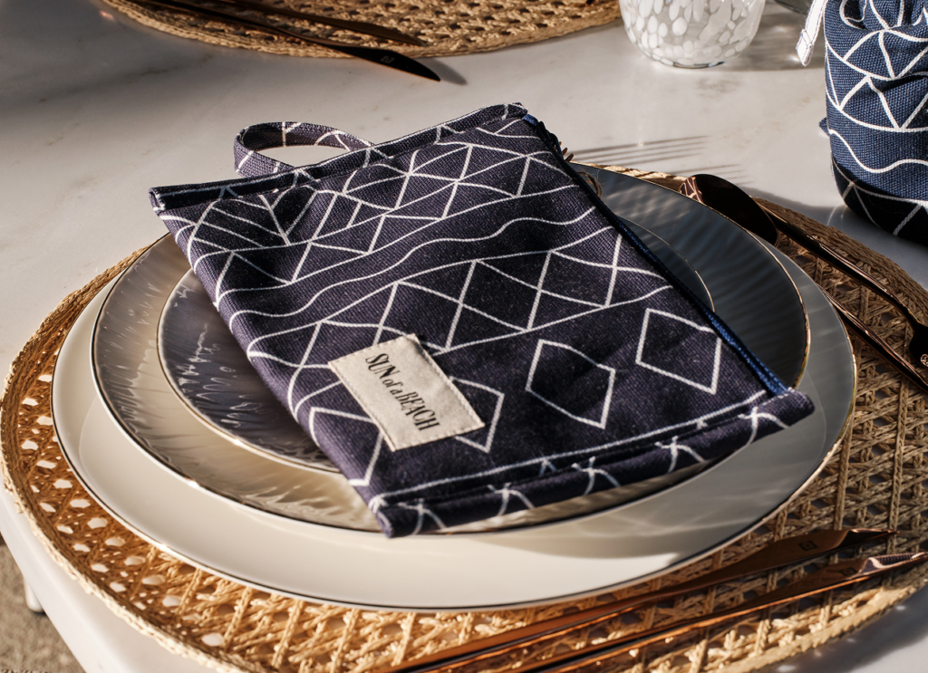 Elegant pouch placed on a plate as a guest gift at a wedding or special event.