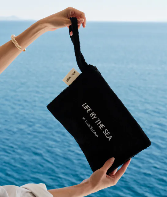 Elegant black pouch for hospitality welcome gifts, perfect for luxury hotel and villa guests.